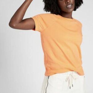 Athleta women's short sleeve sweatshirt in sunrise orange, size XS
